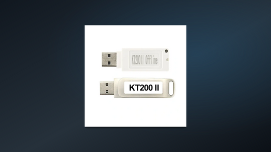 Owner-supplied photograph of two KT200II USB dongles used to identify offline-workstation accessories before support